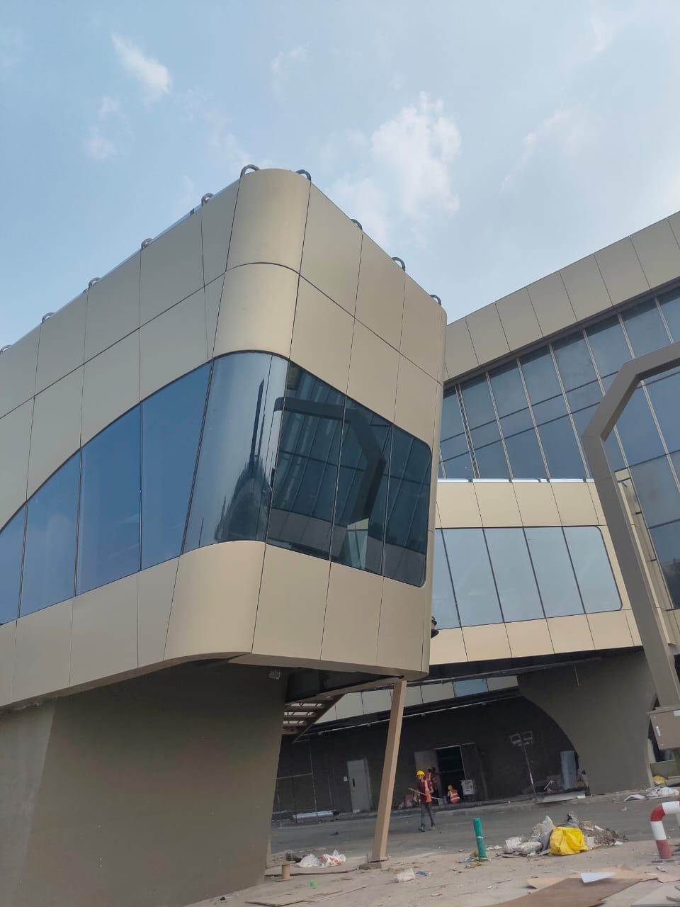 Terminal facade with curved glazing and architectural cladding