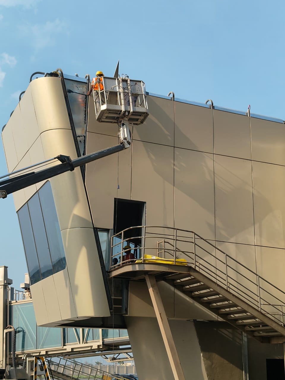 Facade installation using an elevated work platform