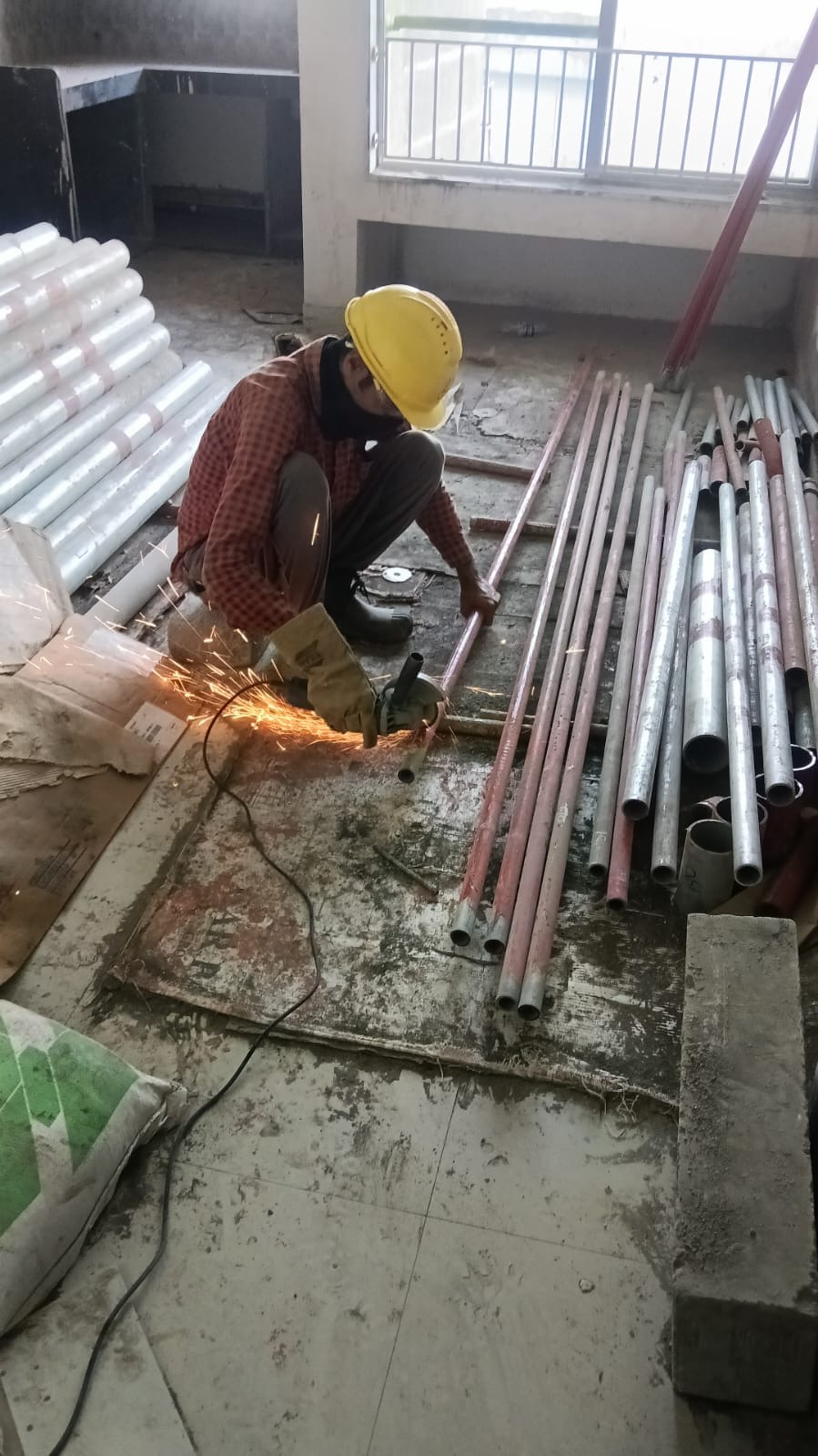 Worker preparing pipe sections for fire fighting installation